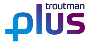 The image is a logo with the word "PLUS" written in large, gradient letters that transition from blue on the left to purple on the right. Above the "US" in "PLUS," there is smaller text that reads "troutman".